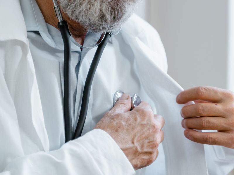 Physician using a stethoscope during a patient examination
